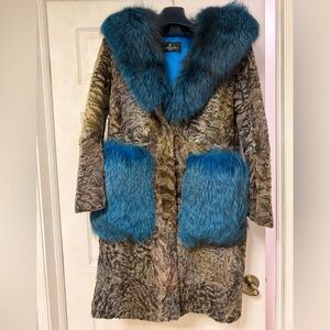 Astrakhan fur coat with a blue fox fur collar and pockets.